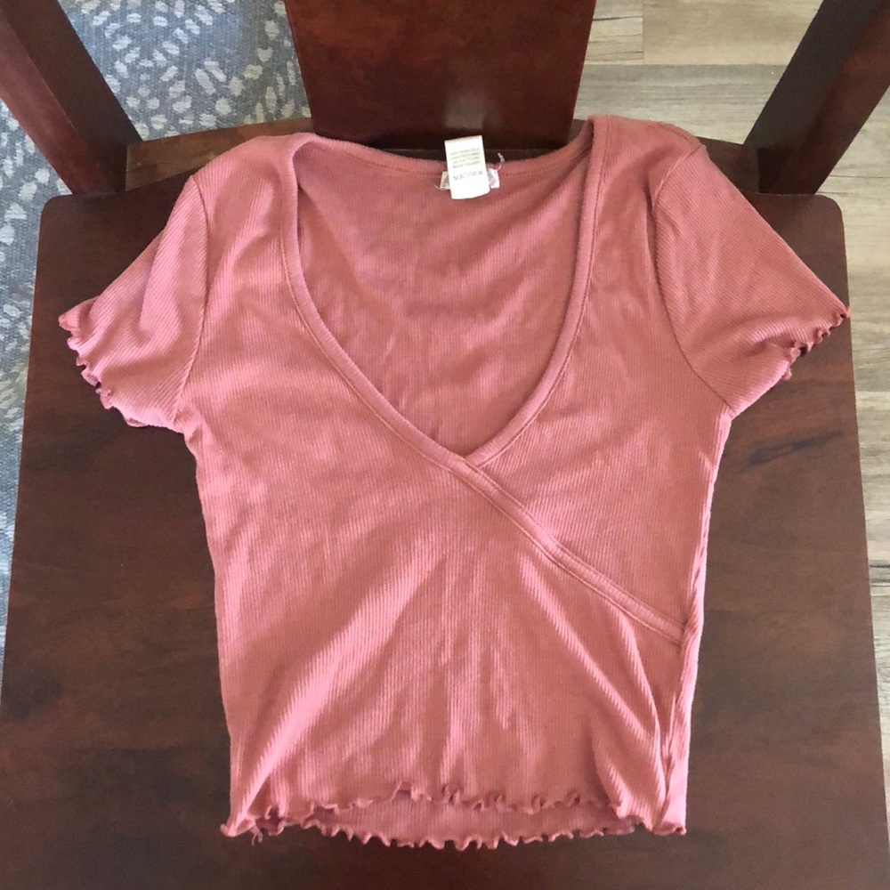 Tilly’s low cut, dark pink, tight cropped tee.